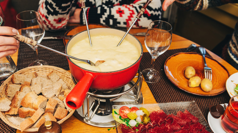 People around fondue pot