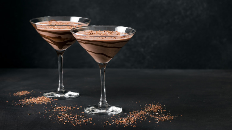 Two chocolate truffle martinis in glasses, showing chocolate layering