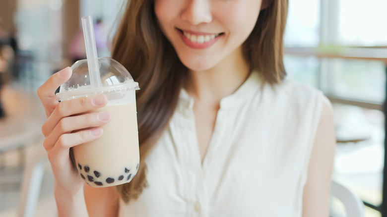 Woman holding bubble tea cup