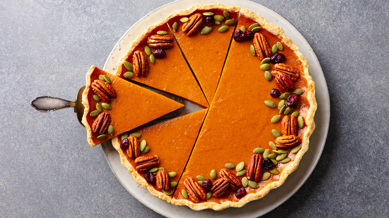 Pumpkin pie garnished with pumpkin seeds