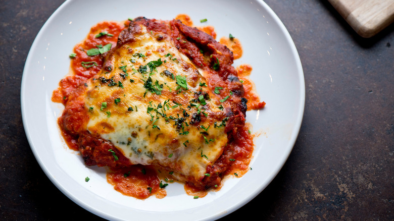 Chicken parm topped with parsley