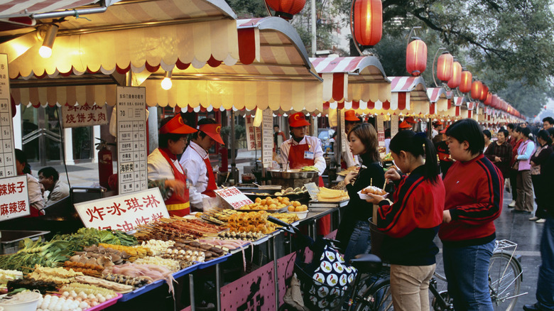 food stands at a street food market in Beijing, China