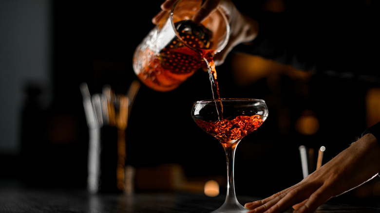 Pouring cocktail into glass