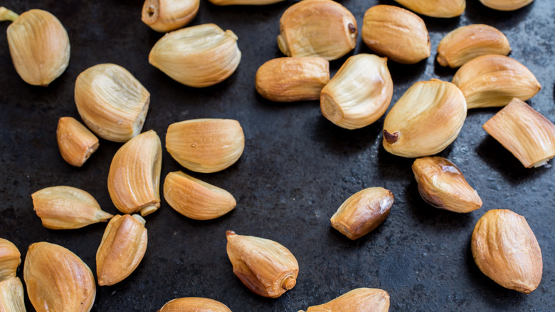 Roasted garlic cloves on slate