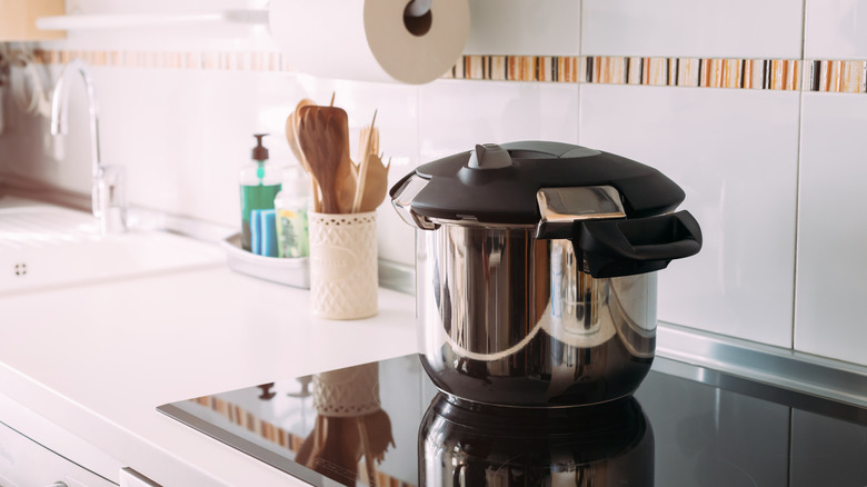 Pressure cooker on stovetop.