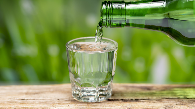 soju pouring into glass