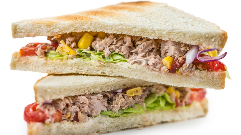 halved tuna sandwich with vegetables