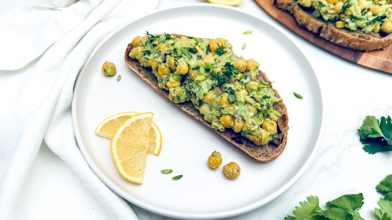 chickpea avocado toast with lemon slices